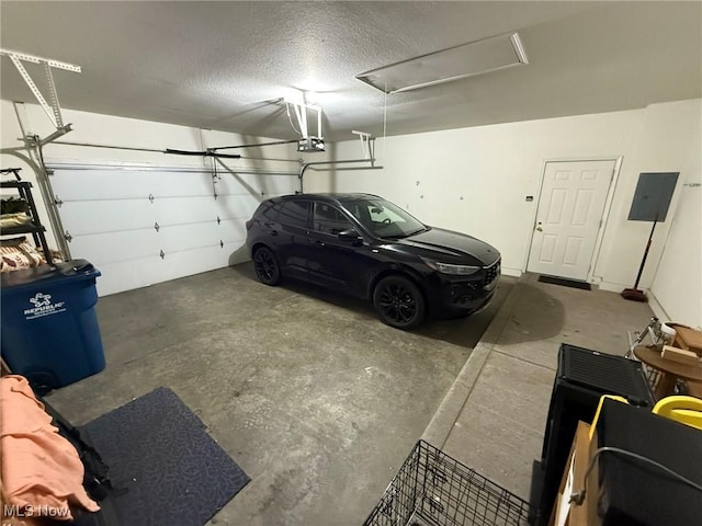5645 Clingan Rd Unit 2D, Struthers, OH 44471 - garage with a garage door opener and electric panel