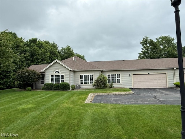 5645 Clingan Rd Unit 2D, Struthers, OH 44471 - single story home featuring driveway, an attached garage, a front yard, and central air condition unit