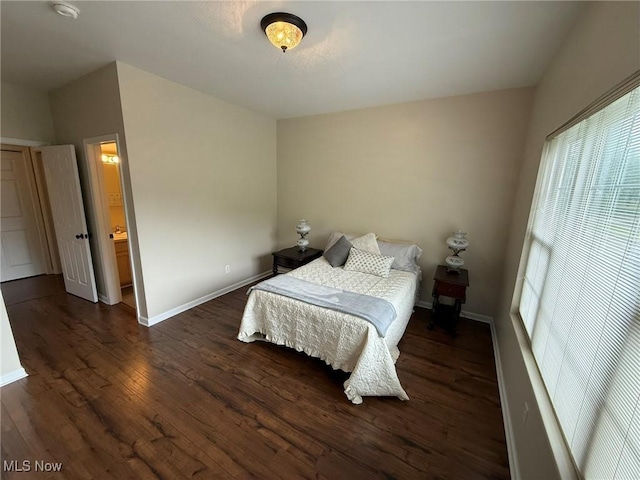 5645 Clingan Rd Unit 2D, Struthers, OH 44471 - bedroom featuring multiple windows, wood finished floors, and baseboards