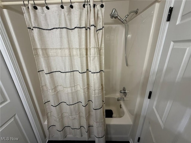 5645 Clingan Rd Unit 2D, Struthers, OH 44471 - bathroom featuring shower / bath combo with shower curtain