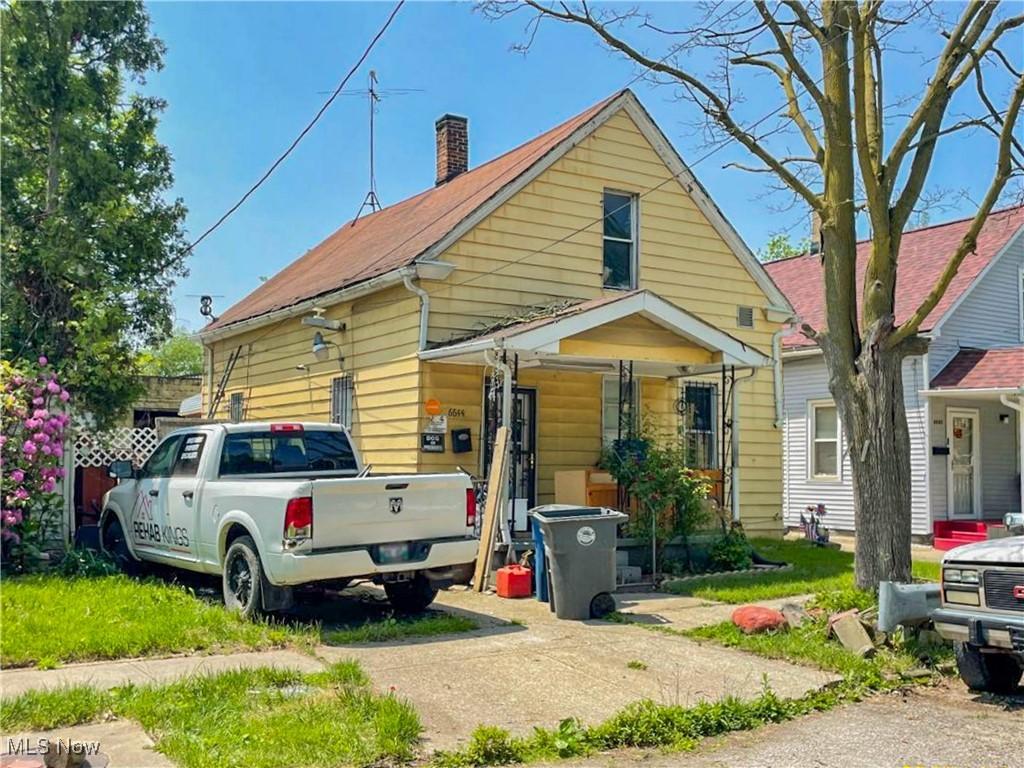 6644 Clement Ave, Cleveland, OH 44105 - view of front of house featuring a chimney