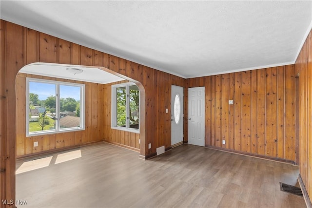 159 Locust St, Wintersville, OH 43953 - entrance foyer with wood finished floors, baseboards, and wood walls