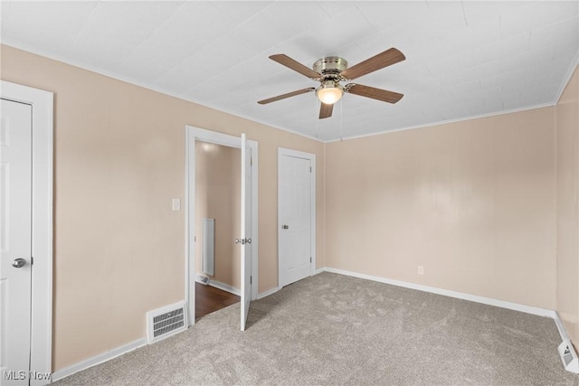159 Locust St, Wintersville, OH 43953 - unfurnished bedroom with carpet, baseboards, crown molding, and a ceiling fan