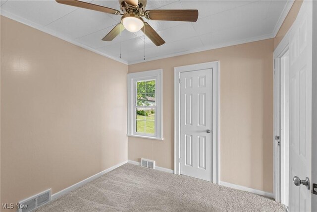159 Locust St, Wintersville, OH 43953 - unfurnished bedroom featuring baseboards, carpet floors, ornamental molding, a closet, and a ceiling fan