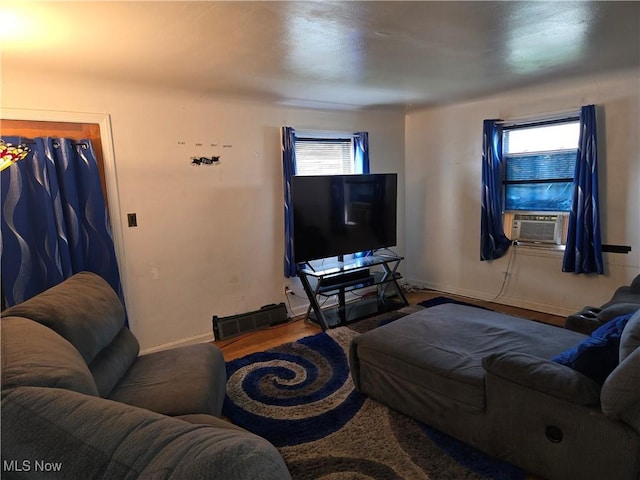 22061 Miller Ave, Euclid, OH 44119 - living room featuring wood finished floors, baseboards, and cooling unit