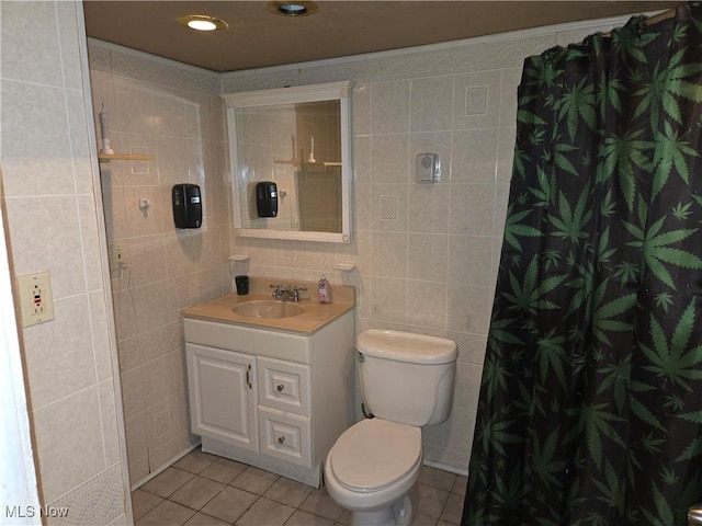22061 Miller Ave, Euclid, OH 44119 - bathroom with tile walls, tile patterned flooring, toilet, vanity, and a shower with curtain