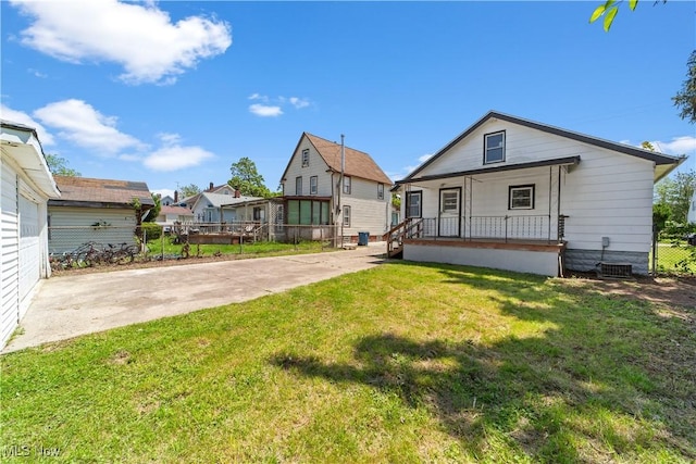 210 W 39th St, Lorain, OH 44052 - back of property featuring a porch and central air condition unit