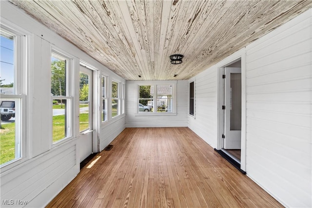 210 W 39th St, Lorain, OH 44052 - unfurnished sunroom featuring wooden ceiling, wooden walls, and wood-type flooring