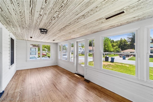 210 W 39th St, Lorain, OH 44052 - unfurnished sunroom with wooden ceiling, wood-type flooring, and wood walls