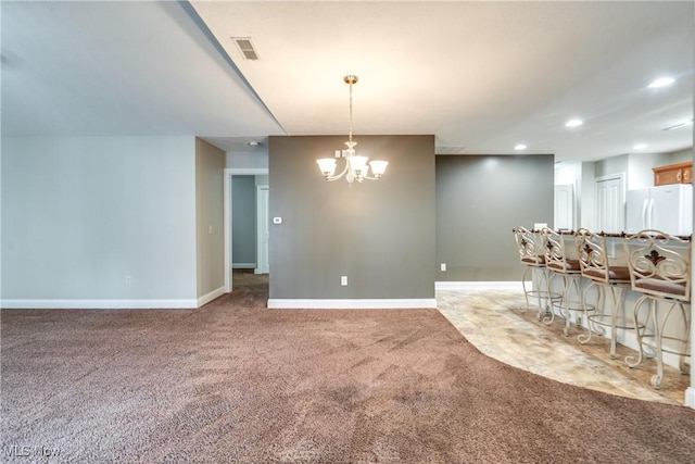 165 Woodbury Glen St, Hartville, OH 44632 - carpeted dining space with a chandelier, recessed lighting, and baseboards