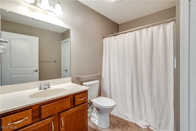 165 Woodbury Glen St, Hartville, OH 44632 - full bath with vanity, toilet, tile patterned flooring, and a shower with shower curtain