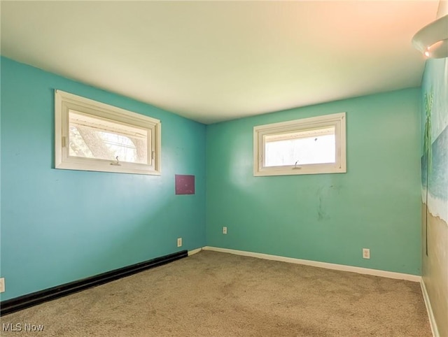 3189 Union Ave SE, Minerva, OH 44657 - carpeted empty room with baseboards and a baseboard heating unit