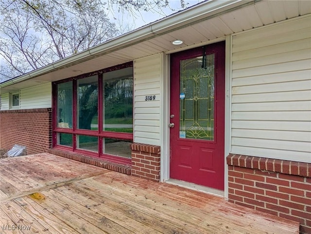 3189 Union Ave SE, Minerva, OH 44657 - view of exterior entry featuring brick siding and a deck