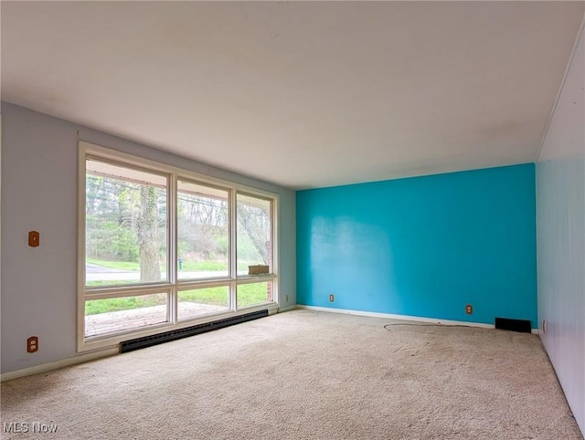 3189 Union Ave SE, Minerva, OH 44657 - carpeted empty room featuring a baseboard radiator and baseboards