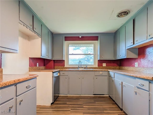3189 Union Ave SE, Minerva, OH 44657 - kitchen featuring dark wood-style flooring, dishwasher, a sink, and light countertops
