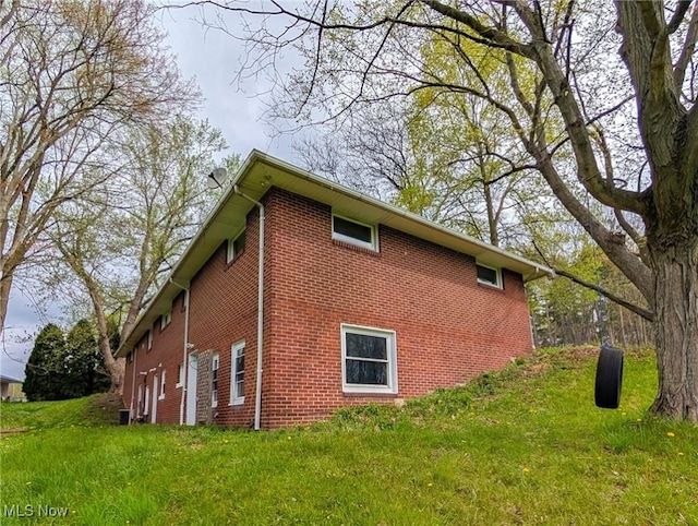 3189 Union Ave SE, Minerva, OH 44657 - view of side of property with brick siding and a lawn