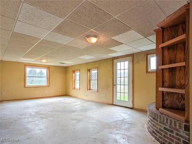 3189 Union Ave SE, Minerva, OH 44657 - unfurnished room with unfinished concrete floors, baseboards, and a drop ceiling