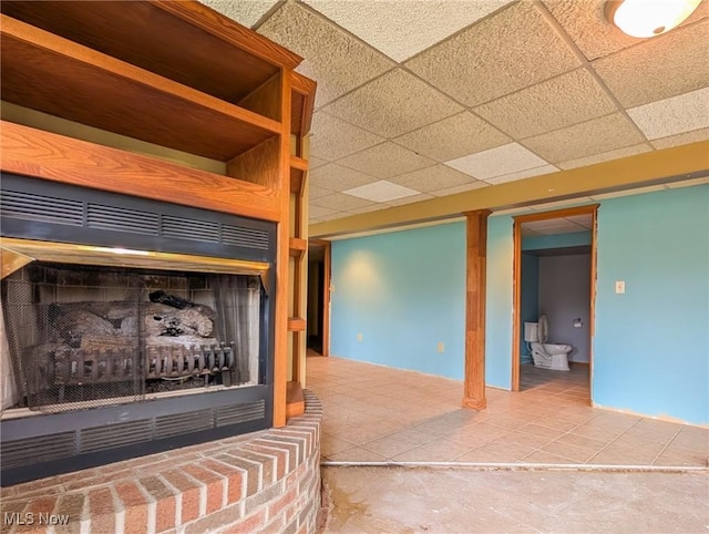 3189 Union Ave SE, Minerva, OH 44657 - unfurnished living room with a paneled ceiling and tile patterned floors