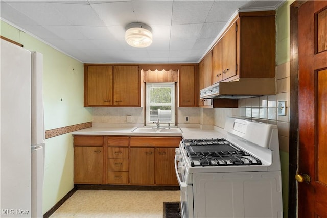 365 Stephens Rd, Akron, OH 44312 - kitchen featuring white appliances, extractor fan, brown cabinetry, light countertops, and a sink