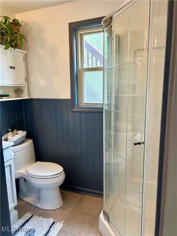 586 Columbia Rd, Valley City, OH 44280 - full bath featuring wainscoting, toilet, a shower stall, tile patterned flooring, and vanity