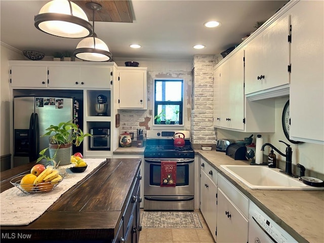 586 Columbia Rd, Valley City, OH 44280 - kitchen featuring appliances with stainless steel finishes, a sink, white cabinets, recessed lighting, and light tile patterned floors