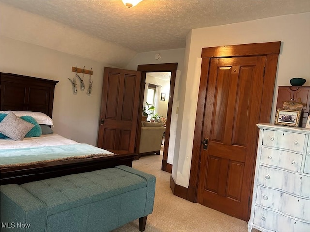 586 Columbia Rd, Valley City, OH 44280 - bedroom featuring light carpet, lofted ceiling, a textured ceiling, and baseboards