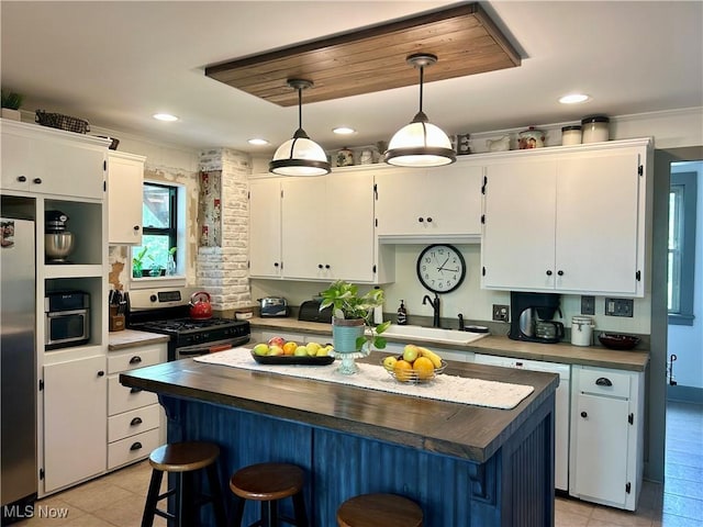 586 Columbia Rd, Valley City, OH 44280 - kitchen featuring a sink, appliances with stainless steel finishes, light tile patterned floors, white cabinets, and recessed lighting
