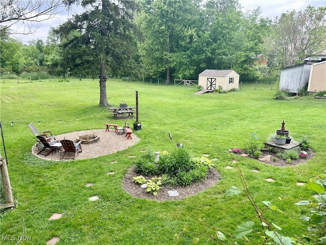 586 Columbia Rd, Valley City, OH 44280 - view of green lawn with an outdoor fire pit