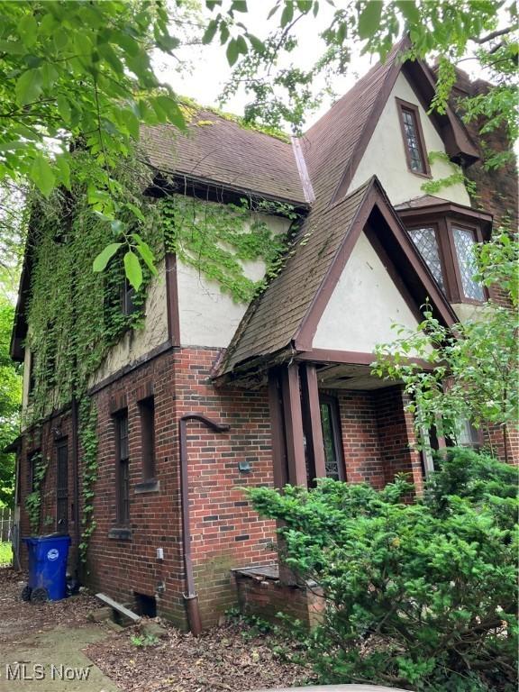 2988 Ludlow Rd, Cleveland, OH 44120 - view of side of home with brick siding and stucco siding