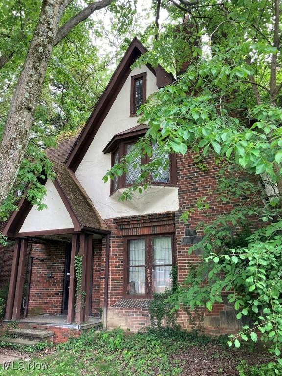 2988 Ludlow Rd, Cleveland, OH 44120 - view of front of house featuring stucco siding and brick siding