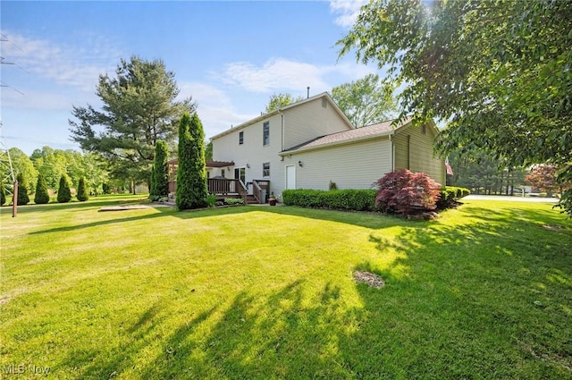 11291 Highland View Dr, Chardon, OH 44024 - back of property with a deck and a lawn