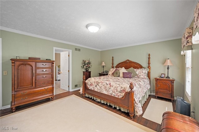 11291 Highland View Dr, Chardon, OH 44024 - bedroom with wood finished floors, baseboards, ornamental molding, and a textured ceiling