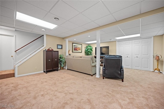 11291 Highland View Dr, Chardon, OH 44024 - living room with carpet floors, stairway, and a paneled ceiling