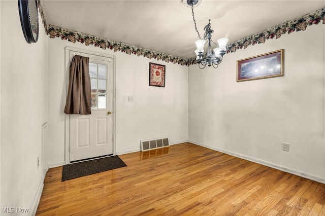 14901 Krems Ave, Maple Heights, OH 44137 - entrance foyer featuring light wood-style floors, a chandelier, and baseboards
