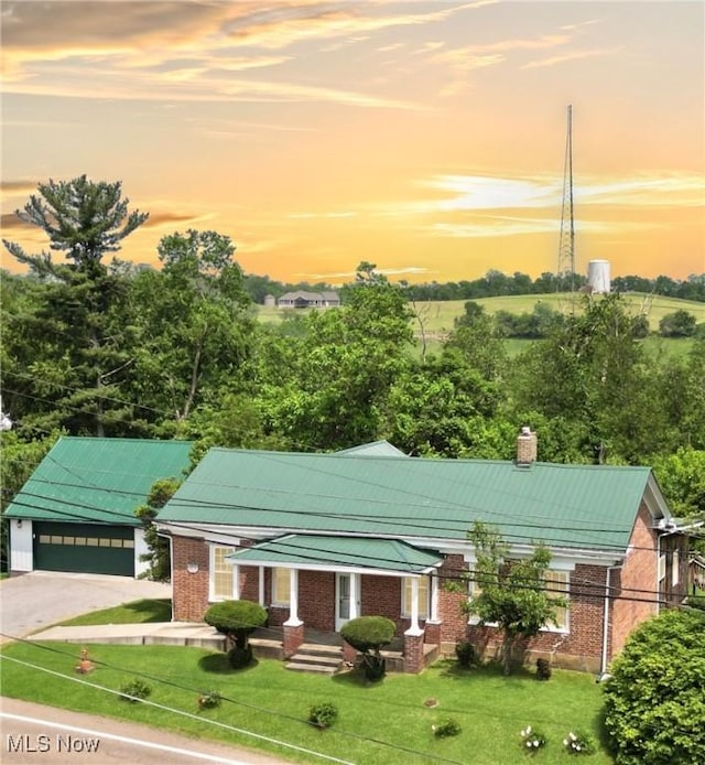 9031 State Route 213, Toronto, OH 43964 - view of front facade with brick siding, a chimney, and a front yard