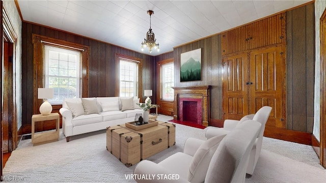 9031 State Route 213, Toronto, OH 43964 - living area with wooden walls, a fireplace with flush hearth, and a chandelier