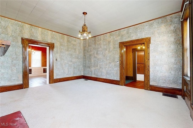 9031 State Route 213, Toronto, OH 43964 - carpeted empty room with ornamental molding, a chandelier, and baseboards