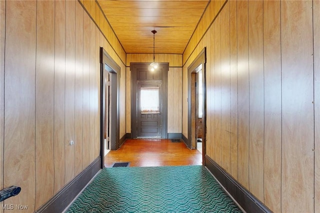9031 State Route 213, Toronto, OH 43964 - hall featuring wooden walls, wood finished floors, and baseboards