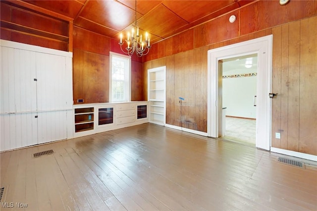9031 State Route 213, Toronto, OH 43964 - unfurnished dining area with wooden walls, a chandelier, hardwood / wood-style flooring, built in features, and wood ceiling