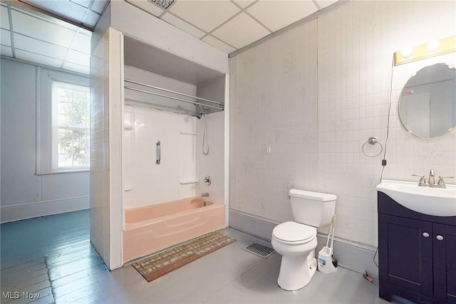 9031 State Route 213, Toronto, OH 43964 - bathroom with vanity, toilet, shower / washtub combination, tile walls, and a paneled ceiling