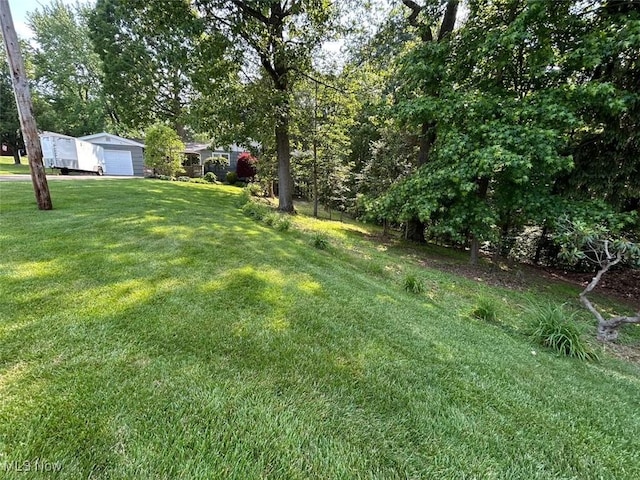 212 Coventry Rd, Marietta, OH 45750 - view of grassy yard featuring a garage