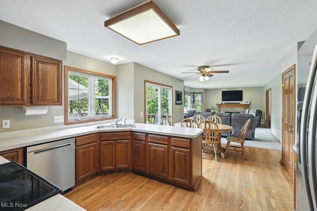 3385 Marsh Rd, Stow, OH 44224 - kitchen with appliances with stainless steel finishes, a sink, light wood-style floors, and a ceiling fan