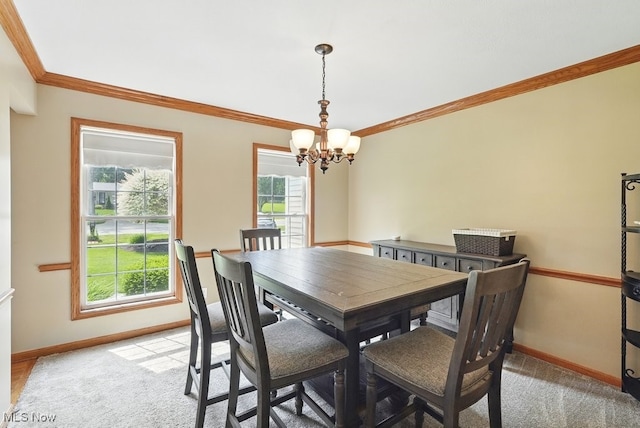 3385 Marsh Rd, Stow, OH 44224 - dining room with a chandelier, baseboards, crown molding, and light carpet