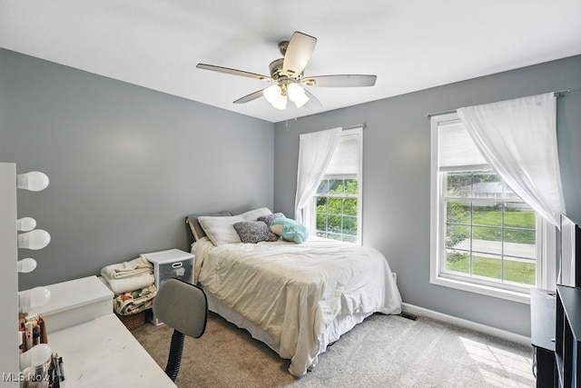 3385 Marsh Rd, Stow, OH 44224 - carpeted bedroom with multiple windows, baseboards, and a ceiling fan