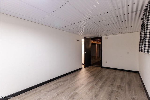 1110 Warren Rd, Newton Falls, OH 44444 - spare room featuring baseboards and light wood finished floors