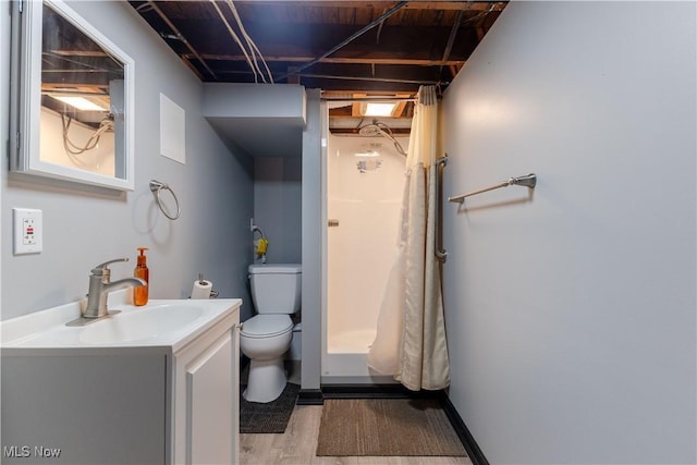 1110 Warren Rd, Newton Falls, OH 44444 - bathroom featuring toilet, vanity, wood finished floors, and a shower with shower curtain