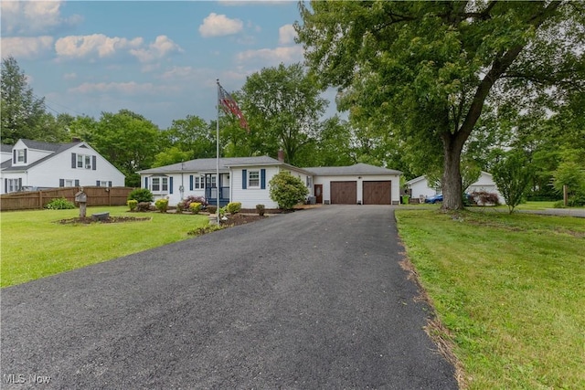 1110 Warren Rd, Newton Falls, OH 44444 - ranch-style home with a garage, driveway, and a chimney