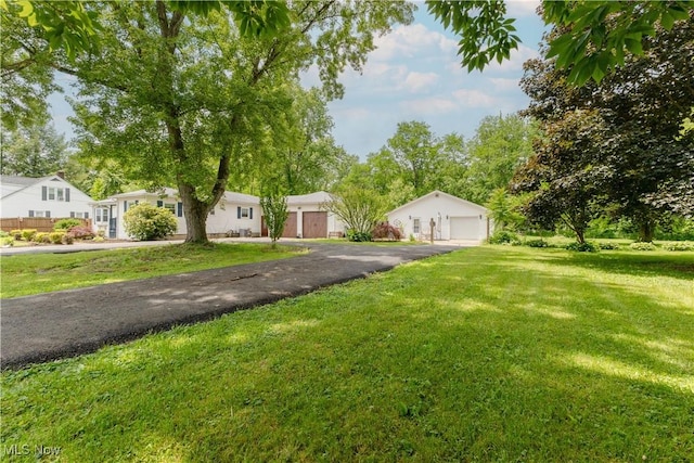 1110 Warren Rd, Newton Falls, OH 44444 - view of front facade with a garage, a front lawn, and a residential view