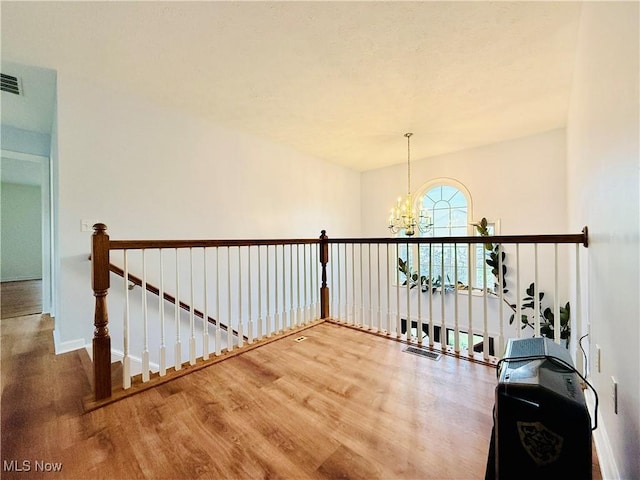 155 Stone Ridge Way, Berea, OH 44017 - hall with a chandelier, wood finished floors, an upstairs landing, and baseboards