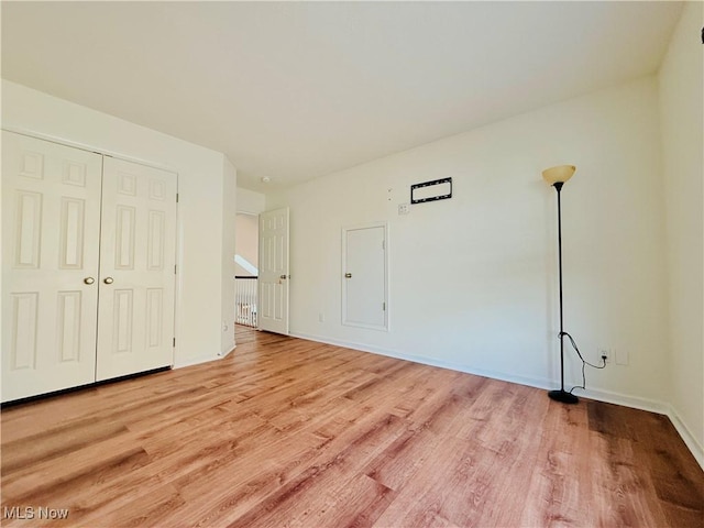 155 Stone Ridge Way, Berea, OH 44017 - unfurnished bedroom with light wood-style floors, baseboards, and a closet
